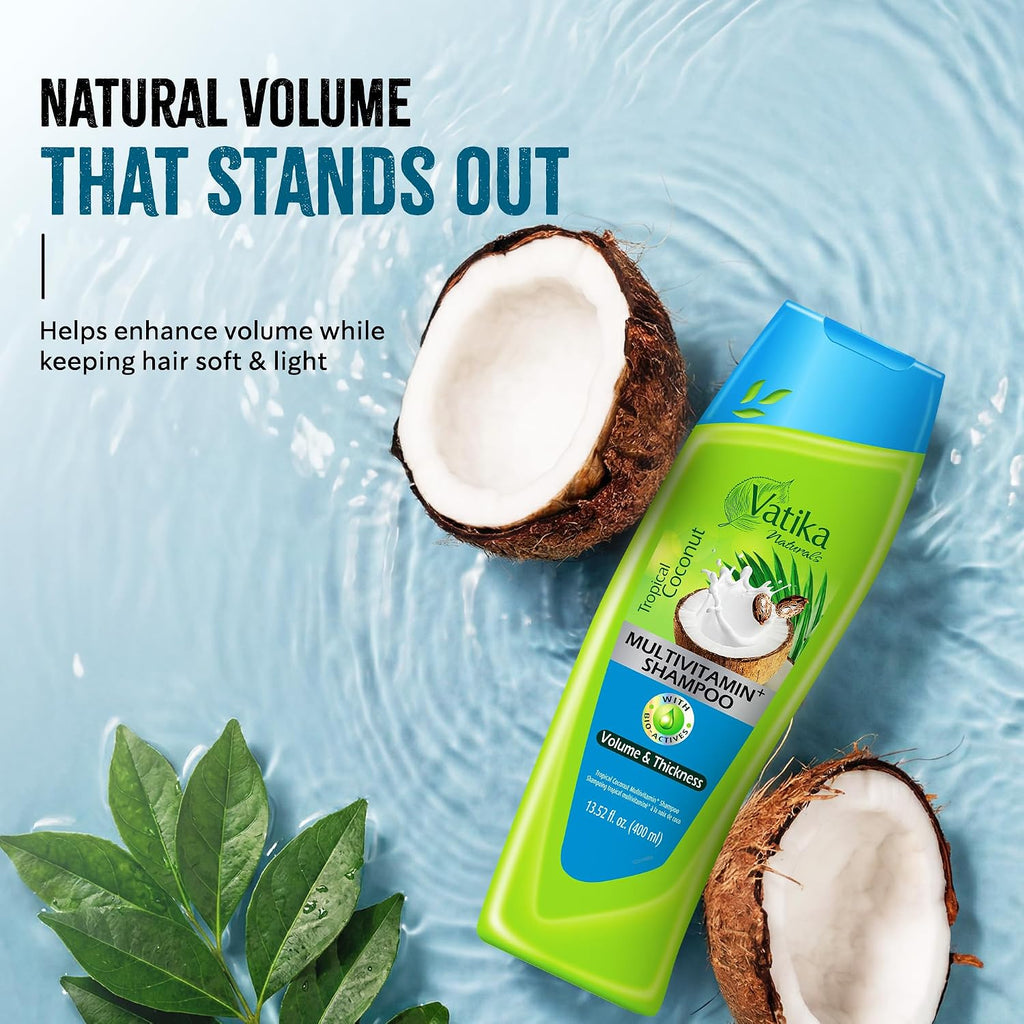Vatika coconut shampoo bottle with coconuts and leaves on a blue water background