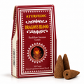 A box of Ayurvedic Dragon's Blood Backflow Incense Cones next to three brown incense cones on a white background.