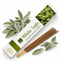 White Sage premium masala intense incense sticks in a white and green box, shown with several brown incense sticks and fresh sage leaves on a white background.